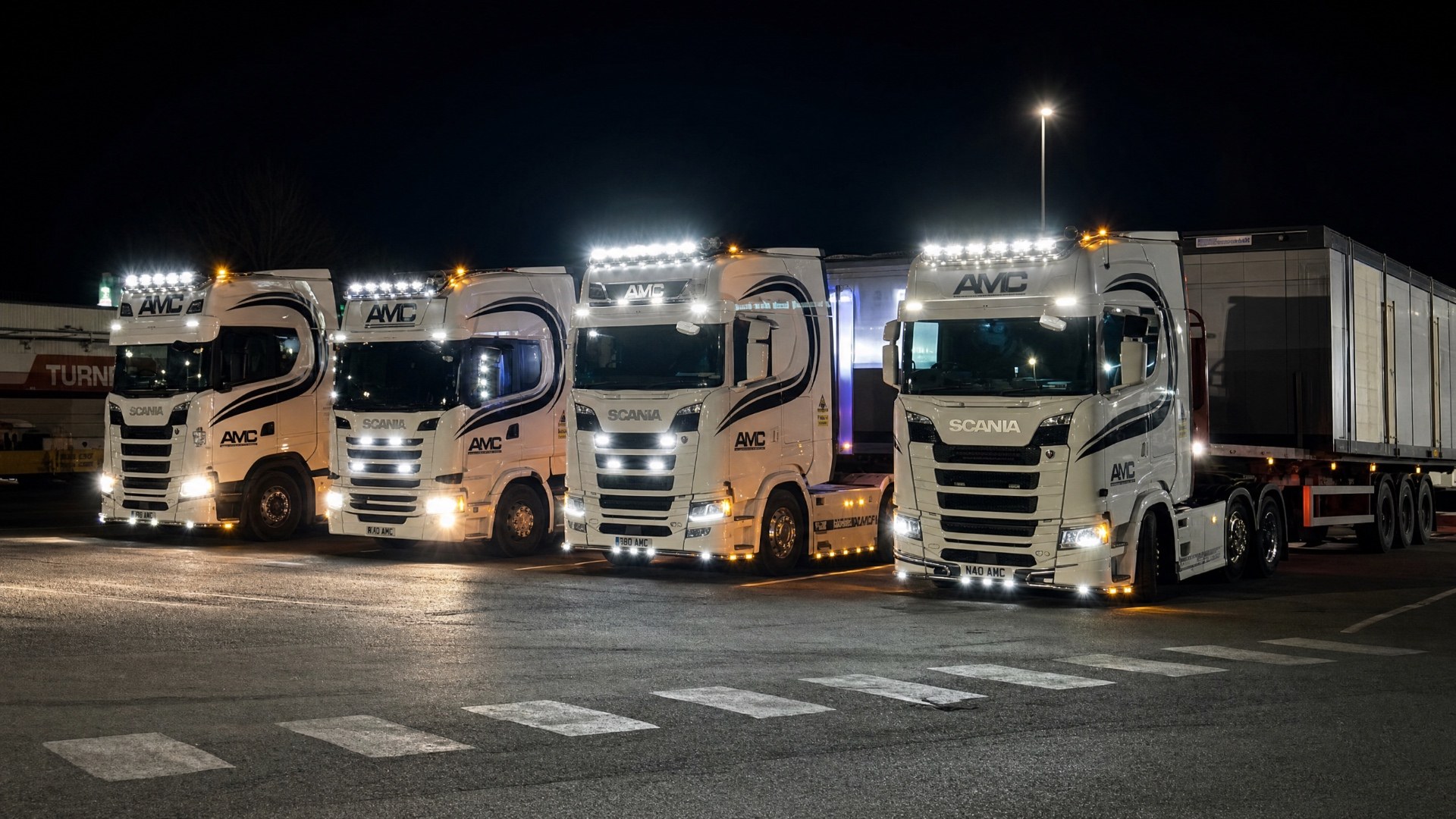 AMC bulk haulage fleet lined up at night