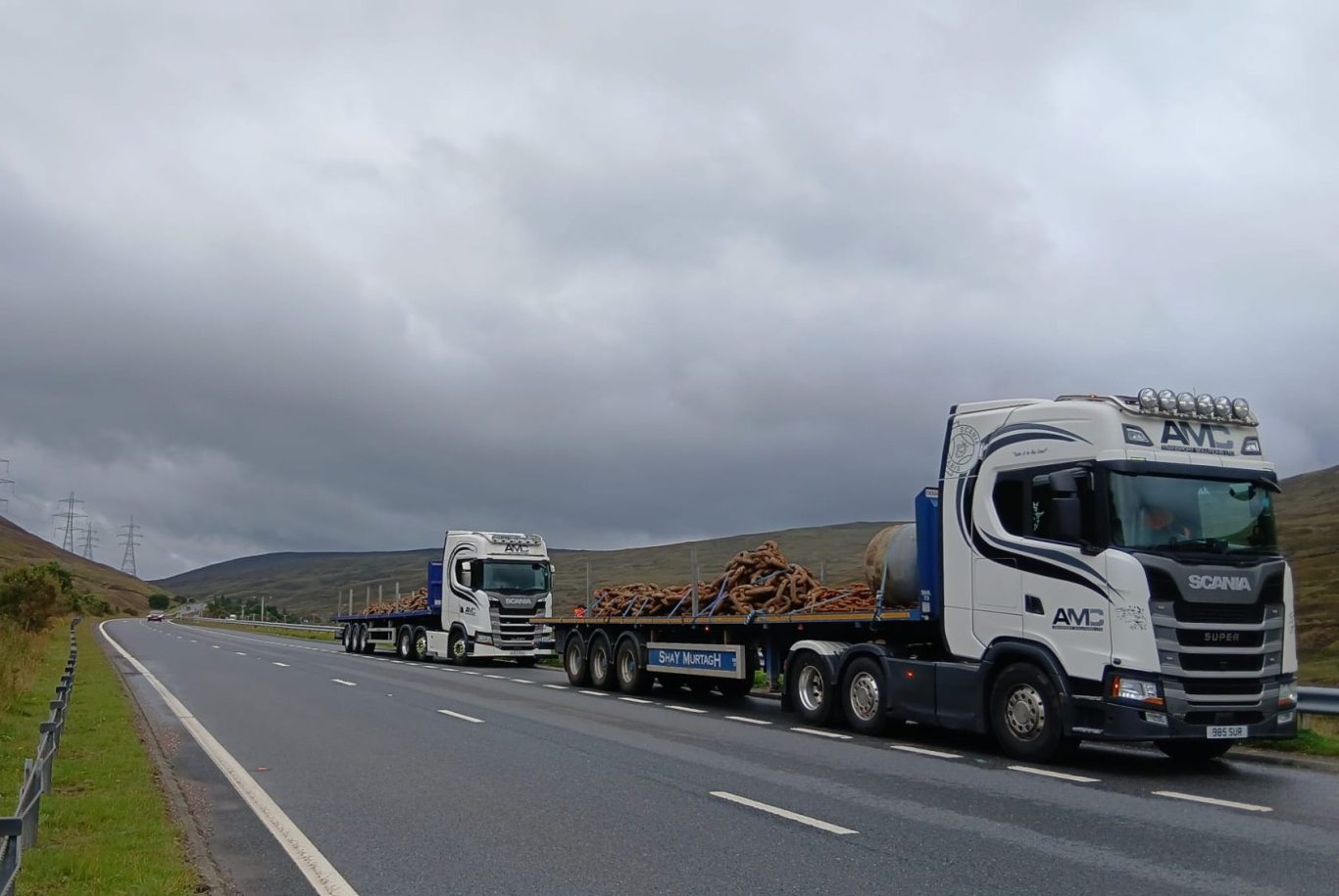 AMC Transport Solutions Ltd Scania tanker on a UK road at dusk
